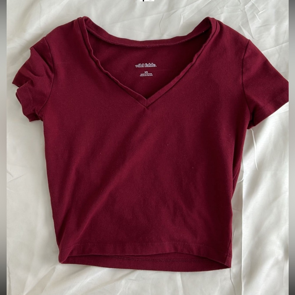 Selling this plain, v- neck, dark red, tee.